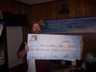 Mark showing off his $10,000 bonus at my home/office March 2007